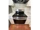 Stainless steel stove with marble countertops and white cabinets, complete with terracotta floor tiles at 3705 Chinaberry Rd, Bradenton, FL 34208