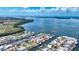 An aerial view showcasing a waterfront property with a boat dock and easy access to open water at 3716 Coconut Ter, Bradenton, FL 34210