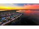 Stunning aerial view of waterfront community at sunset, featuring colorful sky and waterway access at 3716 Coconut Ter, Bradenton, FL 34210