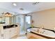 Elegant bathroom featuring a glass shower, soaking tub, and stylish vanity at 3716 Coconut Ter, Bradenton, FL 34210