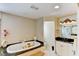 Bathroom featuring a soaking tub with gold fixtures, shower and a vanity at 3716 Coconut Ter, Bradenton, FL 34210