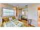 Bedroom with built-in storage, window views, and a mirrored closet at 3716 Coconut Ter, Bradenton, FL 34210