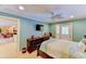 Spacious bedroom with a ceiling fan, TV and an outdoor access door at 3716 Coconut Ter, Bradenton, FL 34210