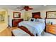 Bedroom with hardwood floors, ceiling fan, and a dresser at 3716 Coconut Ter, Bradenton, FL 34210