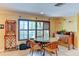 Cozy dining area with tile flooring, natural light, and a view to the front yard and exterior surroundings at 3716 Coconut Ter, Bradenton, FL 34210
