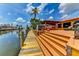 Multi-level deck leading to a private dock, complete with an outdoor kitchen and lounge seating at 3716 Coconut Ter, Bradenton, FL 34210