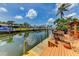 Waterfront living with a private dock and seating, perfect for enjoying serene water views at 3716 Coconut Ter, Bradenton, FL 34210