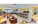 Spacious living room with bar seating that overlooks a comfortable living area and kitchen at 3716 Coconut Ter, Bradenton, FL 34210