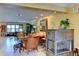 Bright and airy living room with tile flooring, fireplace, and comfortable seating arrangement at 3716 Coconut Ter, Bradenton, FL 34210