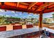 Covered outdoor kitchen and bar area for entertaining, complemented by waterfront views at 3716 Coconut Ter, Bradenton, FL 34210