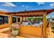 An outdoor kitchen featuring a stainless steel grill and tiled countertop, perfect for entertaining guests at 3716 Coconut Ter, Bradenton, FL 34210