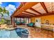 Outdoor lounge featuring a pool, spa, pergola, and comfortable seating at 3716 Coconut Ter, Bradenton, FL 34210