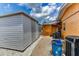 Exterior view of two sheds situated on a gravel bed beside an orange home at 3716 Coconut Ter, Bradenton, FL 34210