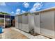 Exterior shot of two white sheds adjacent to a concrete walkway, offering ample storage at 3716 Coconut Ter, Bradenton, FL 34210