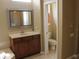 Bathroom showcasing wooden vanity with a large mirror and a separate toilet room at 406 Petrel Trl, Bradenton, FL 34212