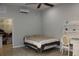 Bedroom with a ceiling fan, walk-in closet, desk, and neutral tones at 406 Petrel Trl, Bradenton, FL 34212