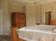 Bedroom features a bed with wooden accents and comfortable decor at 406 Petrel Trl, Bradenton, FL 34212