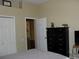 Bedroom with neutral walls featuring a view through the door to an adjacent space at 406 Petrel Trl, Bradenton, FL 34212