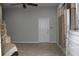 Bedroom with a ceiling fan, dresser, large entry door and natural light at 406 Petrel Trl, Bradenton, FL 34212