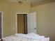 Bedroom featuring a chandelier and a doorway to another room at 406 Petrel Trl, Bradenton, FL 34212