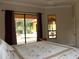 Bedroom with view and access to the pool at 406 Petrel Trl, Bradenton, FL 34212