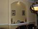 Elegant dining room featuring decorative art and a display niche with a built-in shelf at 406 Petrel Trl, Bradenton, FL 34212