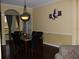 Formal dining room featuring a marble table, leather chairs, and decorative chandelier at 406 Petrel Trl, Bradenton, FL 34212