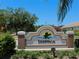 Deerwalk entrance sign boasts manicured landscaping and a welcoming design at 406 Petrel Trl, Bradenton, FL 34212