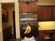 Well-equipped kitchen featuring stainless steel appliances and wooden cabinetry at 406 Petrel Trl, Bradenton, FL 34212