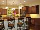 Gourmet kitchen with stainless steel appliances, pendant lighting, and breakfast bar seating for casual dining at 406 Petrel Trl, Bradenton, FL 34212