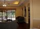 Bright living room boasts elegant archways and access to a screened-in lanai with a pool view, perfect for relaxation at 406 Petrel Trl, Bradenton, FL 34212