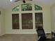 Spacious living room with high ceilings, clerestory windows, and neutral tones at 406 Petrel Trl, Bradenton, FL 34212
