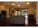 Inviting living room features hardwood floors and a view of the screened-in lanai for seamless indoor/outdoor living at 406 Petrel Trl, Bradenton, FL 34212