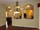 Spacious living room with decorative archways and views of the adjoining rooms at 406 Petrel Trl, Bradenton, FL 34212