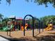 Colorful playground with multiple slides, swings, and climbing structures at 406 Petrel Trl, Bradenton, FL 34212