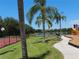 Community playground and tennis court adjacent to a scenic lake at 406 Petrel Trl, Bradenton, FL 34212