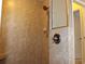 Shower stall with tile walls, bronze showerhead, and handle at 406 Petrel Trl, Bradenton, FL 34212