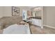 Well-lit bathroom with a garden tub, vanity, and natural light at 4153 Camino Real, Sarasota, FL 34231