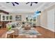 Spacious living room with hardwood floors, tray ceilings, and natural light at 4153 Camino Real, Sarasota, FL 34231