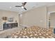 Comfortable main bedroom featuring wood floors, ceiling fan and designer touches at 4153 Camino Real, Sarasota, FL 34231