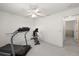 This extra room features neutral carpet flooring and is currently set up for exercise at 4219 Eastlake Ct, Port Charlotte, FL 33948