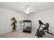 This sun-filled bonus room with neutral carpet is currently set up for exercise at 4219 Eastlake Ct, Port Charlotte, FL 33948