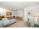 Comfortable bedroom featuring light-colored walls, a ceiling fan, and access to an ensuite bathroom at 4219 Eastlake Ct, Port Charlotte, FL 33948
