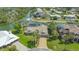 Aerial view of property featuring lush landscaping, boat dock and waterfront access at 452 Picasso Dr, Nokomis, FL 34275