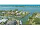 Waterfront home featuring a screened-in pool and a private boat dock with quick access to the Gulf of Mexico at 452 Picasso Dr, Nokomis, FL 34275