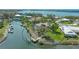 Aerial view showcasing a waterfront property with a pool and private dock at 452 Picasso Dr, Nokomis, FL 34275