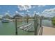 Convenient boat lift on a private dock, providing easy access to the canal and boating opportunities at 452 Picasso Dr, Nokomis, FL 34275