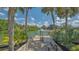Private dock with seating, offering direct access to the canal and scenic waterfront views at 452 Picasso Dr, Nokomis, FL 34275