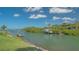 Waterfront home featuring a private dock and boat lift on a scenic canal at 452 Picasso Dr, Nokomis, FL 34275