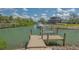 Well-maintained boat dock with lift, situated on a scenic canal with easy access to the water at 452 Picasso Dr, Nokomis, FL 34275